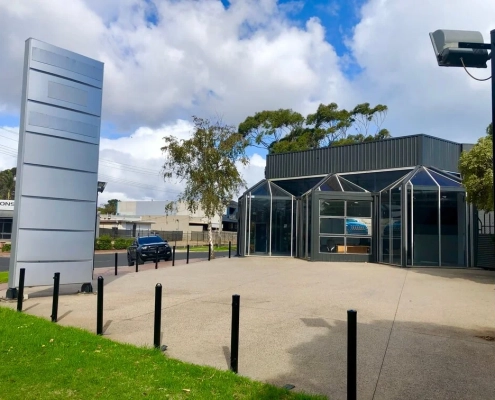 Black Building With Blank Billboard on a Sunny Day